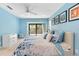 Light blue bedroom with a window view to the deck and a ceiling fan at 1347 Landings Dr # 6, Sarasota, FL 34231