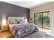 Comfortable bedroom with a large window leading to a balcony and a decorative rug at 1347 Landings Dr # 6, Sarasota, FL 34231