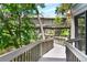 Exterior view featuring a walkway leading to the home, surrounded by trees at 1347 Landings Dr # 6, Sarasota, FL 34231