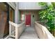 Home's charming entryway featuring a red front door and walkway at 1347 Landings Dr # 6, Sarasota, FL 34231