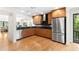 Well-lit kitchen boasts stainless appliances, including refrigerator, stove and backsplash at 1347 Landings Dr # 6, Sarasota, FL 34231