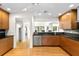 Open kitchen featuring stainless appliances, breakfast bar, and views into living area and hallway at 1347 Landings Dr # 6, Sarasota, FL 34231