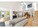 Open living area with fireplace, an open staircase, and lots of natural light at 1347 Landings Dr # 6, Sarasota, FL 34231