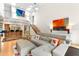 Bright and airy living room featuring a sectional sofa, open floorplan, and a mezzanine at 1347 Landings Dr # 6, Sarasota, FL 34231