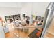 Bright living room featuring vaulted ceilings, a fireplace, modern furniture, and access to an outdoor deck at 1347 Landings Dr # 6, Sarasota, FL 34231