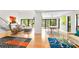 Spacious open-plan living and dining areas with large windows and doors leading to outdoor living spaces at 1347 Landings Dr # 6, Sarasota, FL 34231