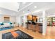 Bright open living room with kitchen bar, modern lighting, and stylish decor create an inviting living space at 1347 Landings Dr # 6, Sarasota, FL 34231