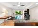 Well-lit home office featuring modern desk, area rug, bookcase, and natural light at 1347 Landings Dr # 6, Sarasota, FL 34231
