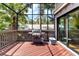 This covered lanai with a grill and sliding doors provides an excellent outdoor cooking and entertaining space at 1347 Landings Dr # 6, Sarasota, FL 34231
