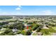 Aerial view of a home in a neighborhood with mature trees and a verdant landscape at 1532 Maricopa Rd, North Port, FL 34287