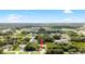 Aerial view of a home nestled in a neighborhood with mature trees and a verdant landscape at 1532 Maricopa Rd, North Port, FL 34287