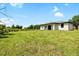 Spacious backyard with lush grass and newly constructed house at 1532 Maricopa Rd, North Port, FL 34287