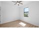 Bedroom with ceiling fan and window providing ample natural light and a pleasant view at 1532 Maricopa Rd, North Port, FL 34287