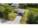 Aerial shot of house featuring brick driveway and beautifully manicured front yard at 1532 Maricopa Rd, North Port, FL 34287