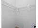 A clean, well-lit walk-in closet space with wire shelving, ready for organization at 1532 Maricopa Rd, North Port, FL 34287