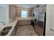 Well-equipped kitchen with grey cabinetry, stainless steel appliances, and stylish backsplash at 16048 Ivy Ridge Ct, Port Charlotte, FL 33953