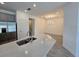 Modern kitchen featuring a spacious island, stainless steel appliances, and a dining area at 16048 Ivy Ridge Ct, Port Charlotte, FL 33953