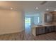 Bright, open-concept kitchen with sleek countertops, stainless steel appliances, and hardwood floors at 16048 Ivy Ridge Ct, Port Charlotte, FL 33953