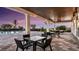 Inviting outdoor patio with ample seating, providing a serene space for relaxation and dining at 16048 Ivy Ridge Ct, Port Charlotte, FL 33953