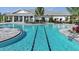 Resort-style swimming pool with lounge chairs and tables for relaxing by the water at 16048 Ivy Ridge Ct, Port Charlotte, FL 33953