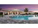 Stunning swimming pool featuring a covered outdoor dining area for entertaining guests at 16048 Ivy Ridge Ct, Port Charlotte, FL 33953