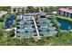 Overhead view of luxurious community amenities, including tennis courts, pool, and scenic ponds at 1627 Peregrine Point Ct, Sarasota, FL 34231