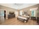 Serene Primary bedroom with a vaulted ceiling, tile floors, and lots of natural light at 1627 Peregrine Point Ct, Sarasota, FL 34231