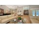 Bright living room featuring neutral walls, hardwood floors, stylish furnishings, and a view of the grand entrance at 1627 Peregrine Point Ct, Sarasota, FL 34231