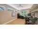 Bright home office with multiple windows and views to the outside at 1627 Peregrine Point Ct, Sarasota, FL 34231