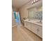 Bright bathroom featuring double sink vanity and decorative accents for a modern, clean look at 1646 Pierpoint St, North Port, FL 34288