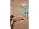 Cozy bedroom with carpeted floor, makeup vanity, and comfortable furnishings at 1646 Pierpoint St, North Port, FL 34288