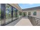 Spacious balcony area with dark framed glass doors and black metal railing allowing for seamless indoor-outdoor living at 1658 Bonita Ln, Sarasota, FL 34239