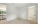 A cozy room, showcasing a doorway and a large window offering natural light and a view of the greenery at 1658 Bonita Ln, Sarasota, FL 34239