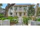 Charming home exterior with a manicured front yard, stone pathway, balcony, and an inviting entryway at 1658 Bonita Ln, Sarasota, FL 34239