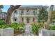 Stunning two-story home featuring a landscaped front yard, balcony, and elegant entrance at 1658 Bonita Ln, Sarasota, FL 34239