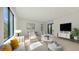 Bright living room features modern furniture, large windows, and stylish decor creating a comfortable living space at 1658 Bonita Ln, Sarasota, FL 34239