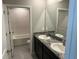 Bathroom with a dual vanity, undermount sinks, granite counters and a shower and tub combo at 17637 Cantarina Cv, Bradenton, FL 34211