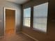 Bright bedroom with neutral walls, plush carpeting, and natural light from two windows at 17637 Cantarina Cv, Bradenton, FL 34211