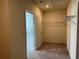Walk-in closet providing ample storage with easy access hanging shelves at 17637 Cantarina Cv, Bradenton, FL 34211