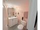 Bathroom featuring double sinks, large mirror, and tile floor at 1959 Toucan Way # 206, Sarasota, FL 34232