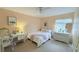 Inviting bedroom showcasing a full size bed, bright window, and an ample dresser at 1959 Toucan Way # 206, Sarasota, FL 34232