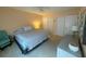 Bedroom featuring two closets, a ceiling fan, and a nightstand at 1959 Toucan Way # 206, Sarasota, FL 34232