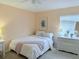 Inviting bedroom showcasing a full size bed, bright window, and an ample dresser at 1959 Toucan Way # 206, Sarasota, FL 34232