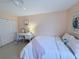 Cozy bedroom featuring a comfortable bed, desk, and ample closet space at 1959 Toucan Way # 206, Sarasota, FL 34232