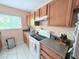 Bright kitchen featuring modern appliances and plenty of cabinet storage at 1959 Toucan Way # 206, Sarasota, FL 34232