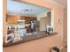 Open concept kitchen with granite counters, wood cabinets, and stainless steel appliances at 1959 Toucan Way # 206, Sarasota, FL 34232