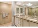 Well-lit bathroom with double sinks, modern fixtures, and a skylight at 2103 Harbourside Dr # 1102, Longboat Key, FL 34228