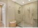Modern bathroom featuring a glass shower, mosaic tile floor, and ample space at 2103 Harbourside Dr # 1102, Longboat Key, FL 34228