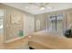 Stylish bedroom featuring stylish décor, closet, and a modern ceiling fan at 2103 Harbourside Dr # 1102, Longboat Key, FL 34228