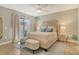 Beautiful bedroom featuring stylish décor, and modern ceiling fan at 2103 Harbourside Dr # 1102, Longboat Key, FL 34228